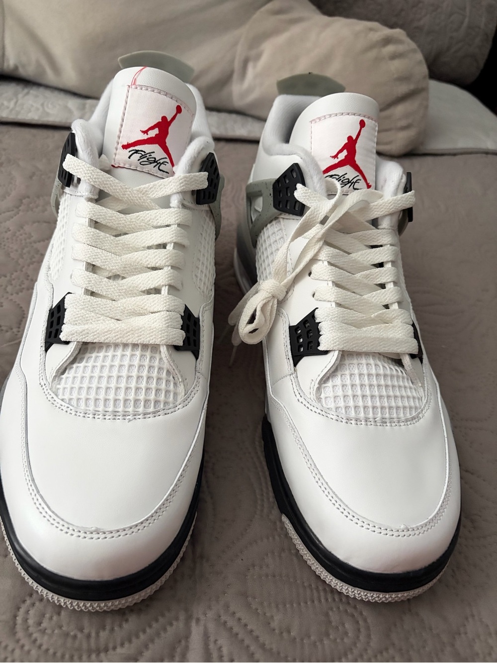 Nike White and Red Jordan 4 Retro Sneakers with Black Accents